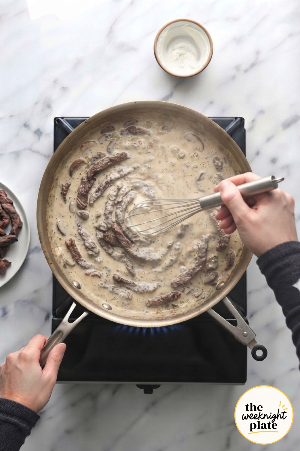 Seared beef folds back into the creamy sauce, nearly finishing this low carb beef stroganoff skillet.