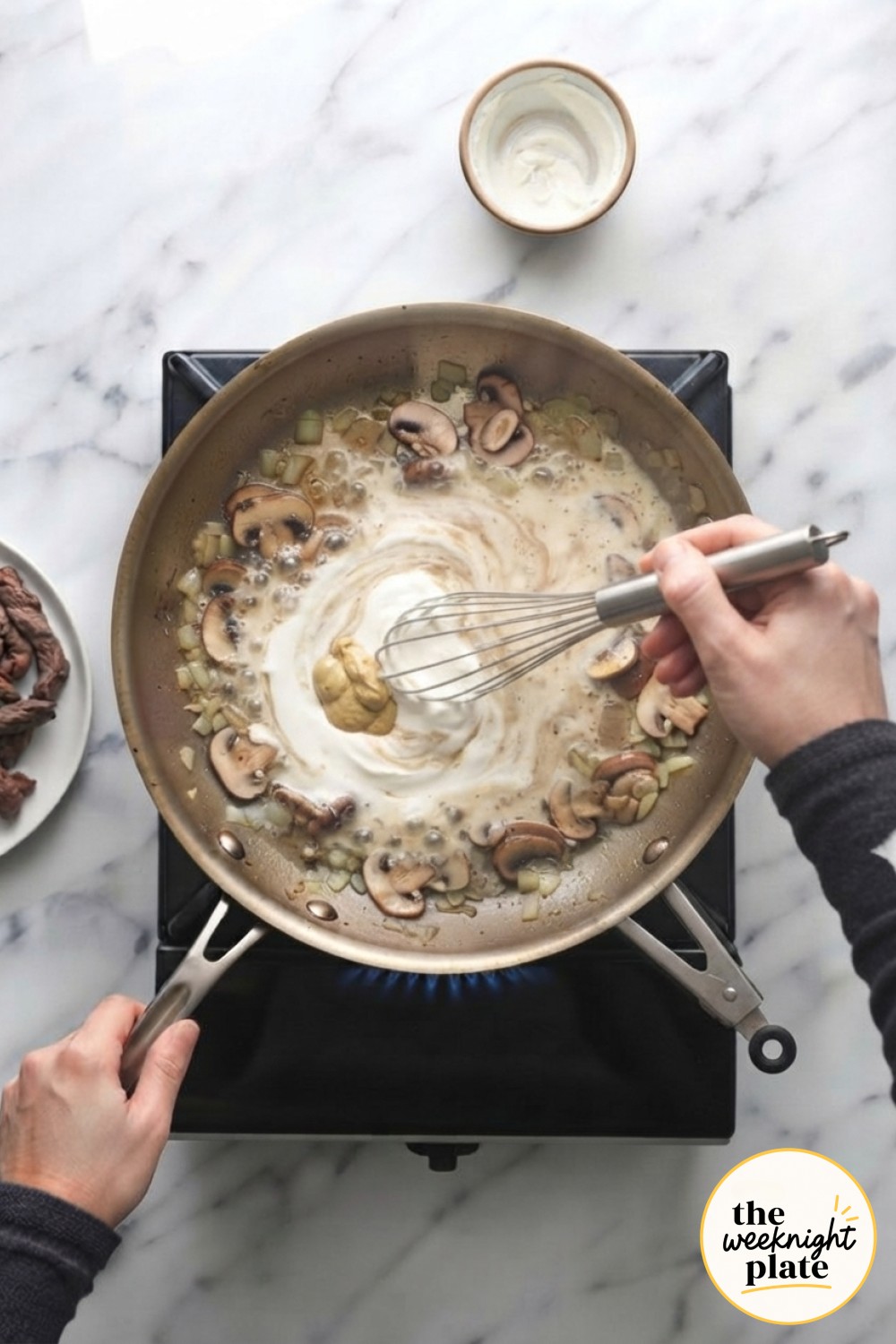 Sour cream and Dijon get whisked into simmering broth, thickening the sauce for low carb beef stroganoff.